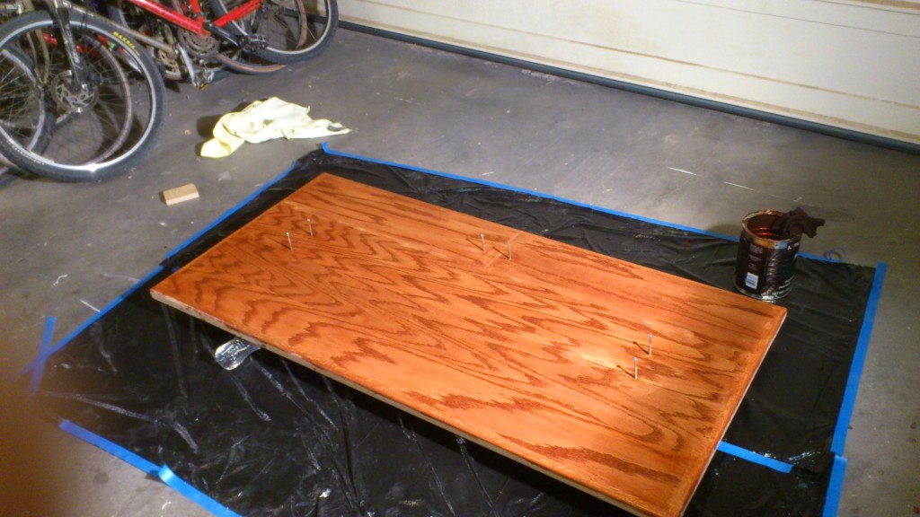 After a few coats of wipe-on poly. There are 9 coats total. The staining wasn't done very well, and it became very uneven and mixed with the first two coats of poly